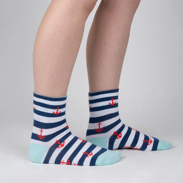 Turn cuff sock in blue and white stripe with orange anchors and a cartoon sailor cat