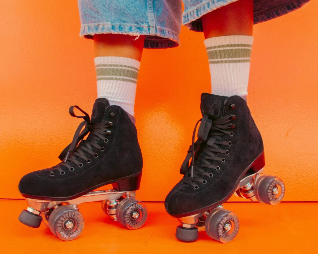 Roller Skater wears Chuffed Skates Wanderer Roller Skates in Black - a sleek looking suede skate.