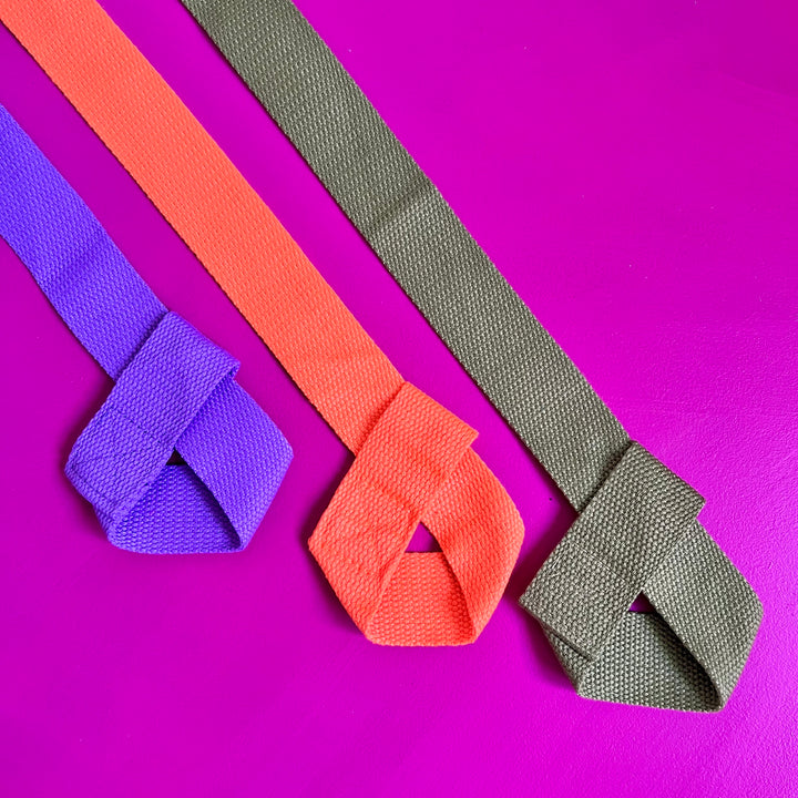 3 RollerFit Roller Skate Leashes place diagonally on a fuchsia background.