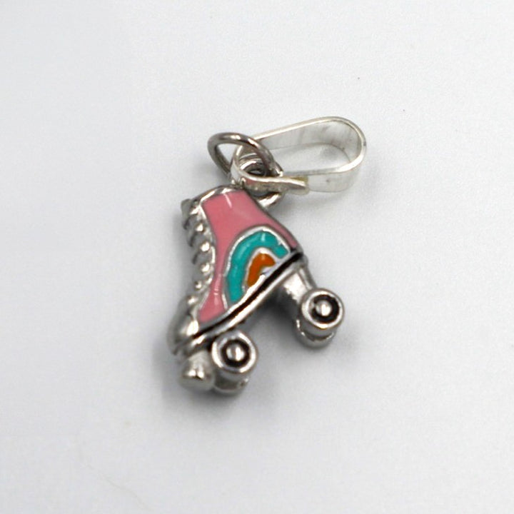 Silver roller skate pendant charm with pink, blue and orange enamel design on roller skate boot.