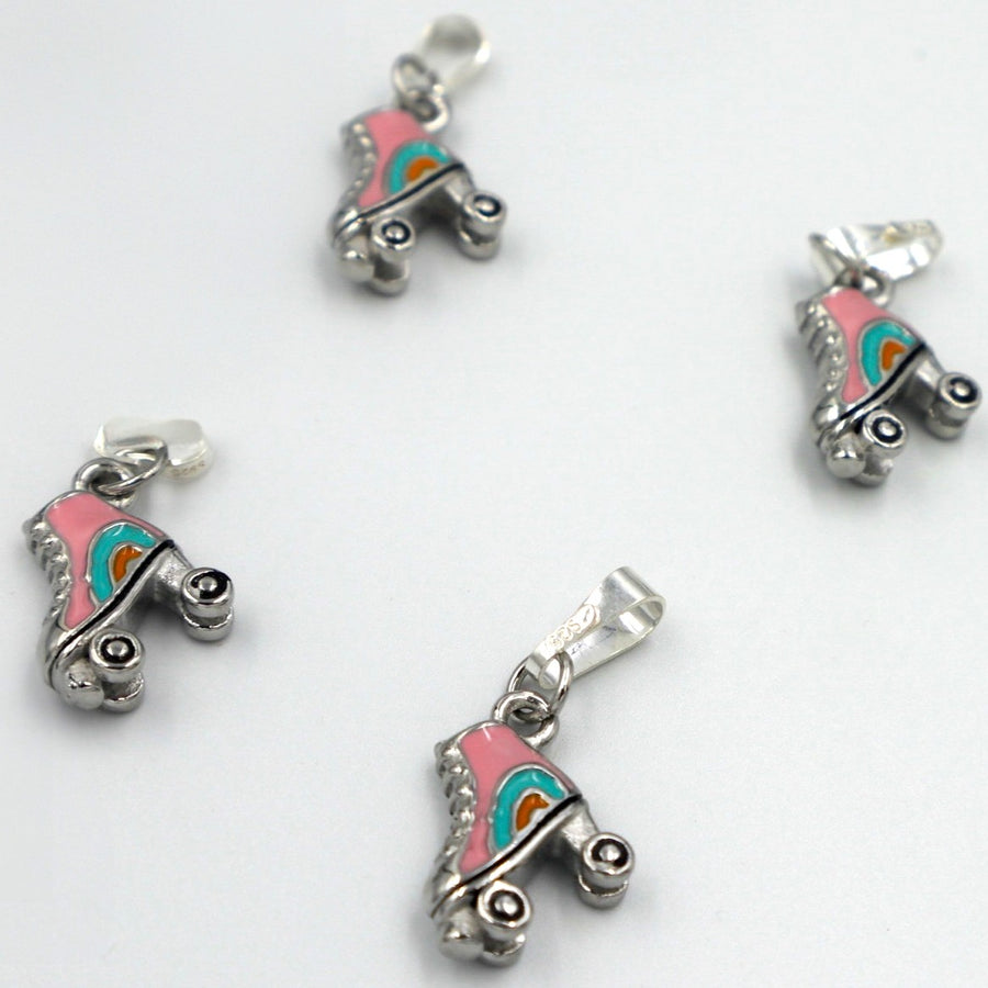 4 RollerFit Roller Skate Pendant Charms in silver arranged on a white surface