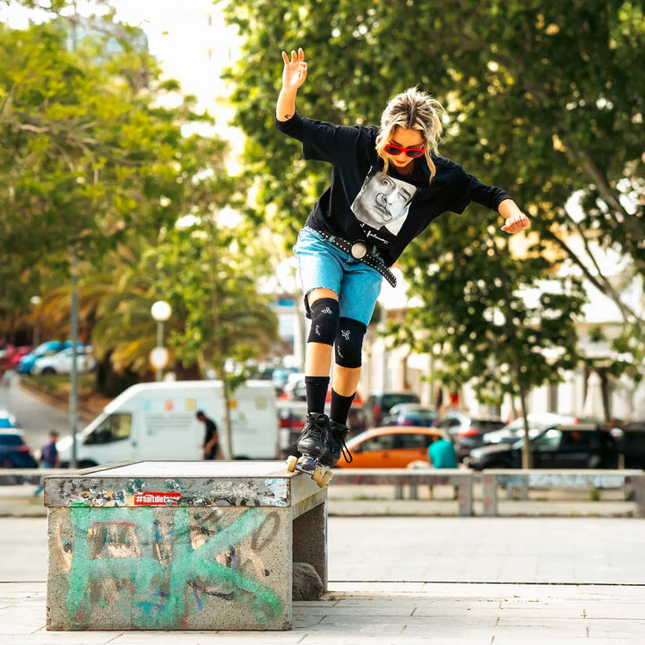 Barbie Patin street skating wearing the reversible Triple 8 knee pads