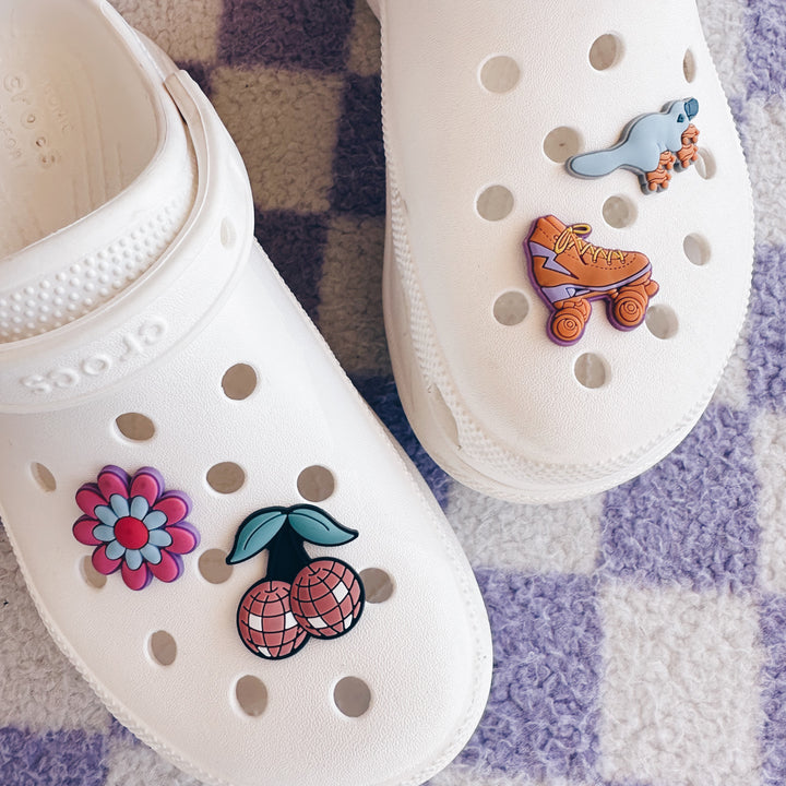 RollerFit clog charms on white clogs