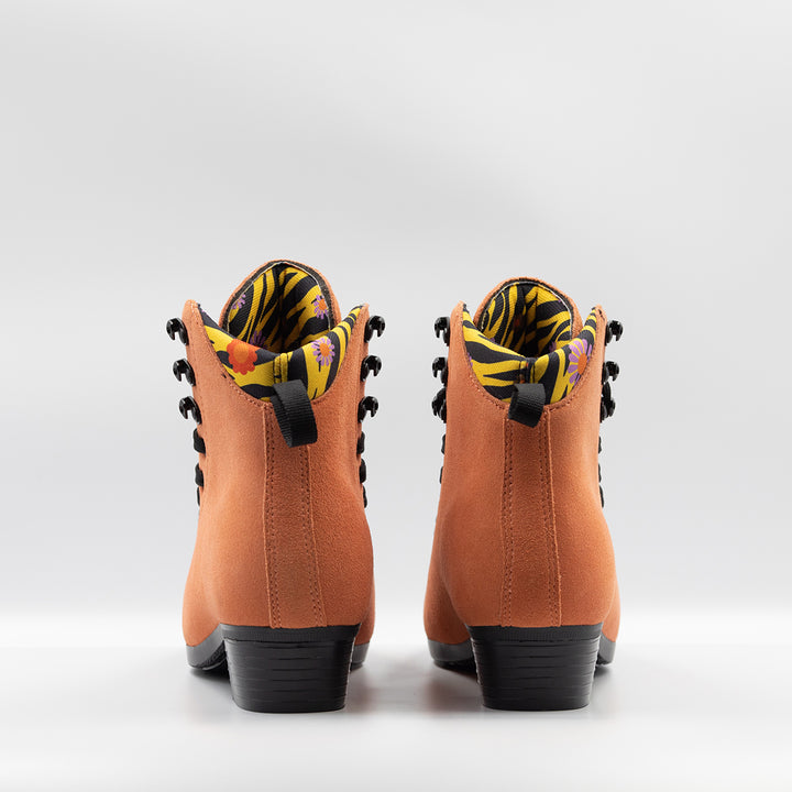 Chuffed Skates Wild Thing Pro Boots, orange suede with black laces and soles, yellow/black tiger print and floral lining.