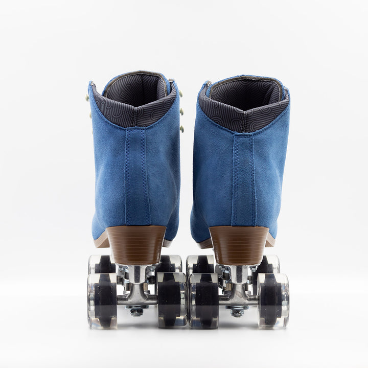 Chuffed Skates Wanderer roller skates in classic blue with cream laces and eyelets, black toe stop, and clear wheels.