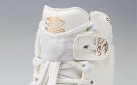Edea Lace Straps in white strapped on the middle hook of white Edea boot.