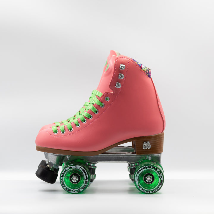 Moxi Roller Skates Beach Bunny skates in Watermelon pink with bright green laces and wheels.