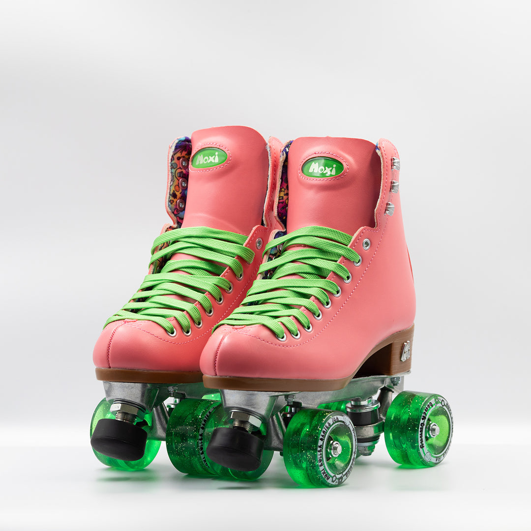 Moxi Roller Skates Beach Bunny skates in Watermelon pink with bright green laces and wheels.