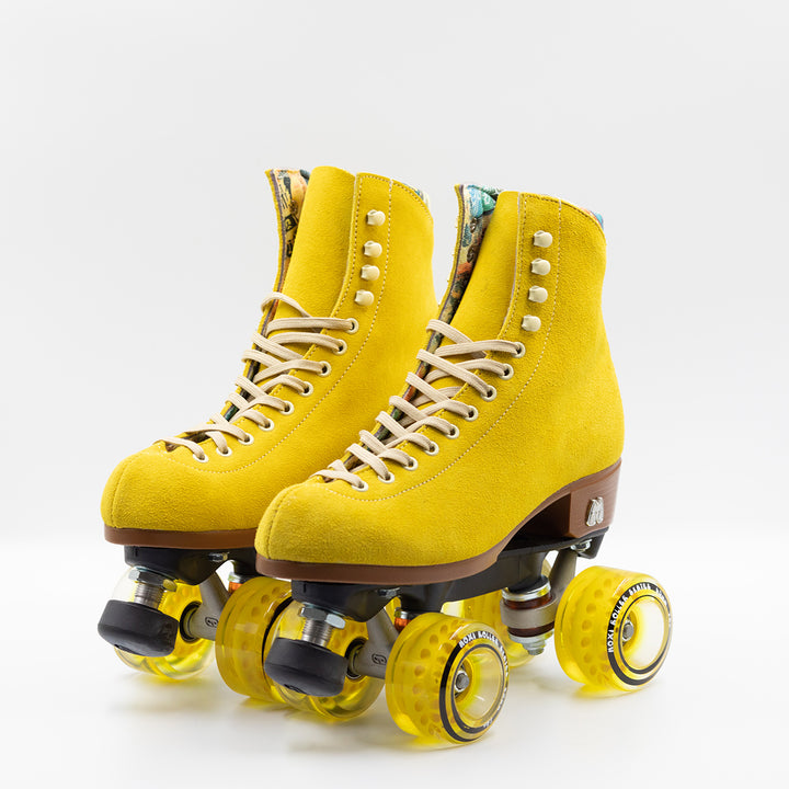 Moxi Roller Skates Lolly roller skates in Pineapple yellow with oyster laces and eyelets, tan sole, black plate and toe stop, matching yellow wheels.