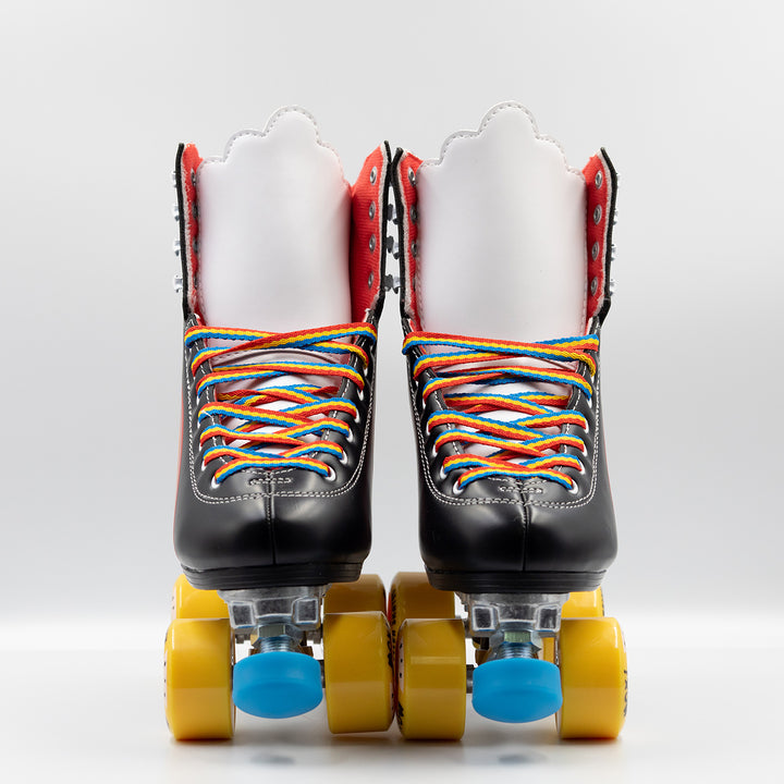 Moxi Roller Skates Rainbow Riders in Asphalt Black with white tongue, yellow wheels and blue toe stops.