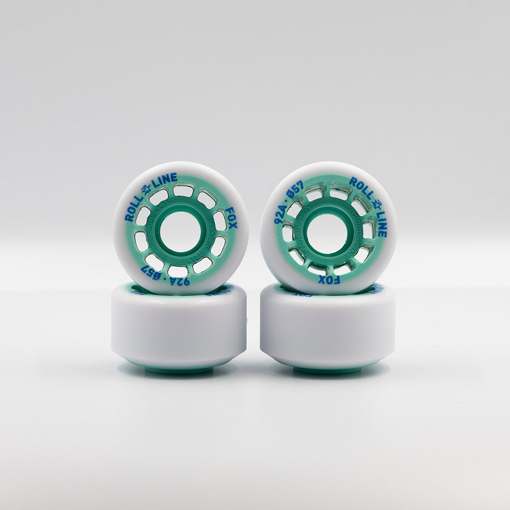 Roll-Line Fox wheels, white tread with teal hub.