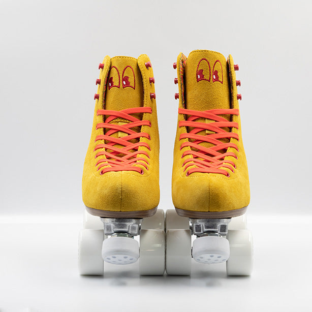 Chuffed Skates Birak roller skates with mustard yellow boots, coral laces, eyelets and logo embroidery, white wheels and toe stops.