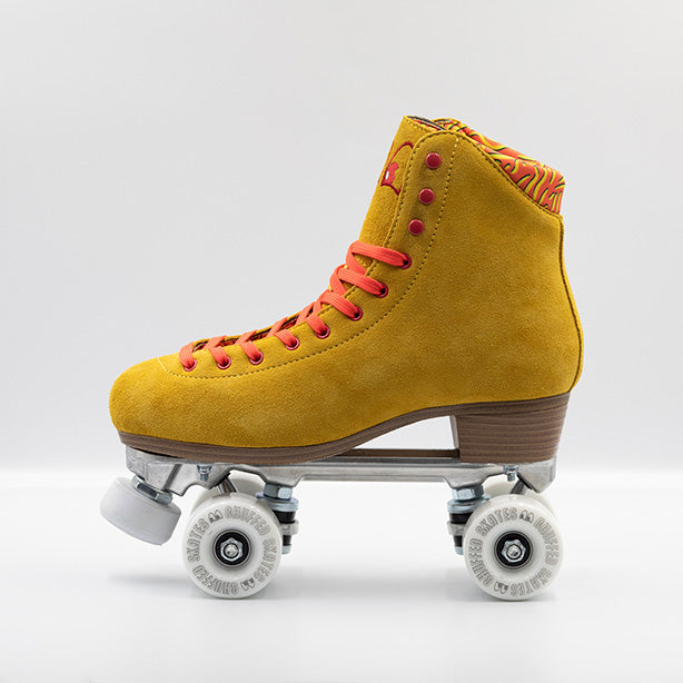 Chuffed Skates Birak roller skates with mustard yellow boots, coral laces, eyelets and logo embroidery, white wheels and toe stops.