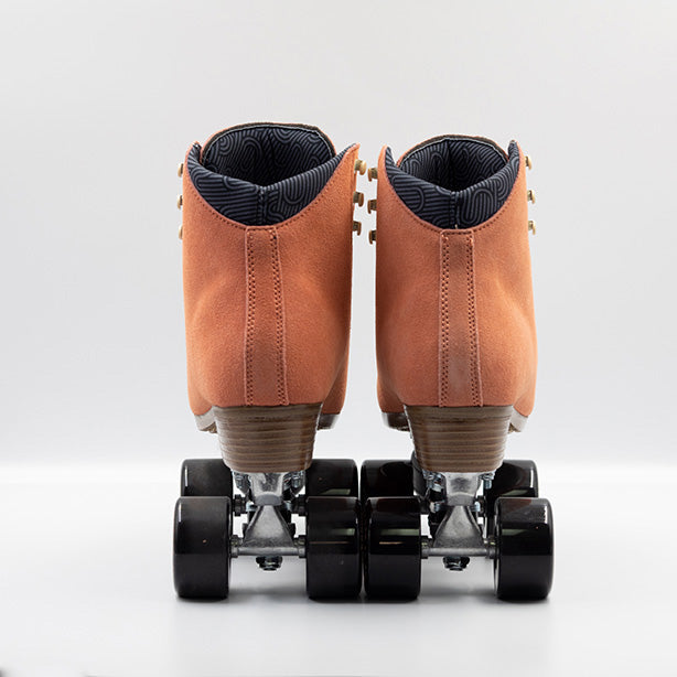 Chuffed Skates Wanderer Roller Skates in Peach Pink with cream laces and embroidered Chuffed eye logo on tongue, black wheels and toe stop.