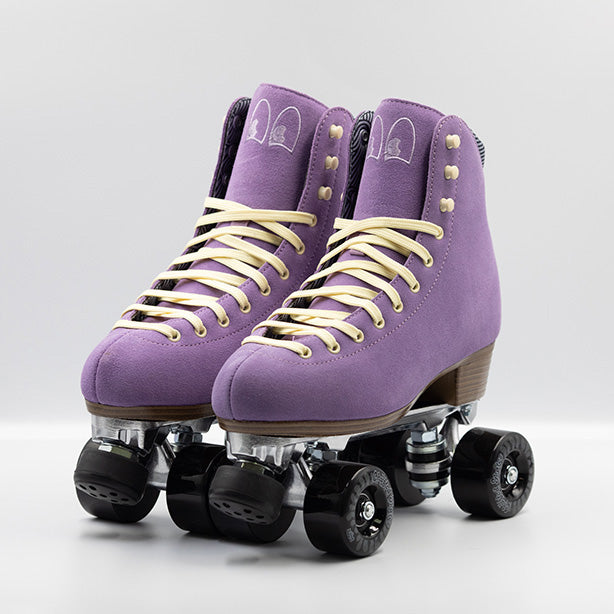 Chuffed Skates Wanderer roller skates in Jacaranda Purple with cream laces, eyelets and logo embroidery on the tongue, black wheels and toe stops.