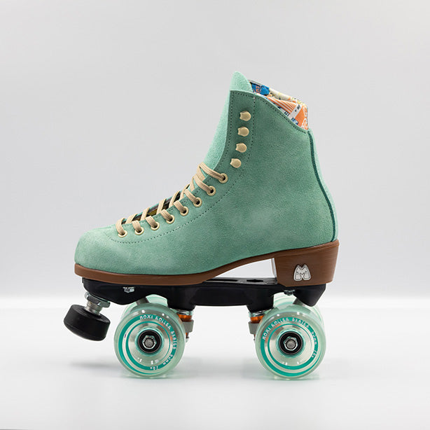 Moxi Roller Skates Lolly roller skates in Floss teal with oyster laces and eyelets, tan sole, black plate and toe stop, matching teal wheels.