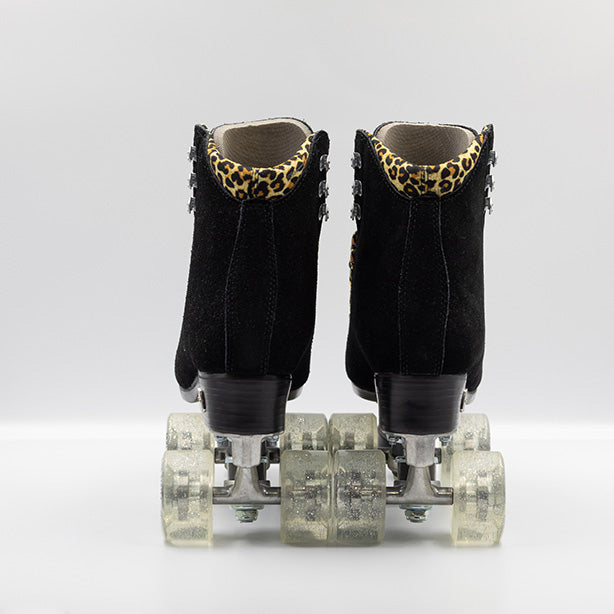 Moxi Roller Skates Panther black roller skates with clear glitter wheels, leopard laces and lining.