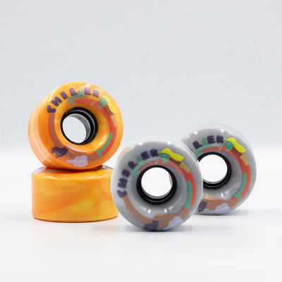 Chuffed Skates Chiller Wheels in Sunny (orange/yellow swirl) and Cloudy (grey/white swirl).