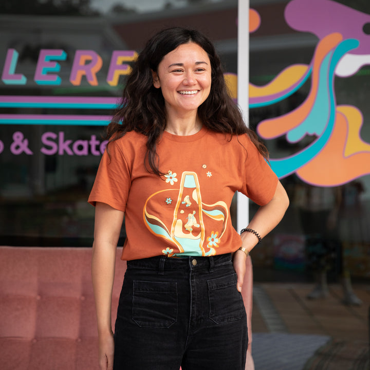 Mel wears the RollerFit lava t-shirt in copper.