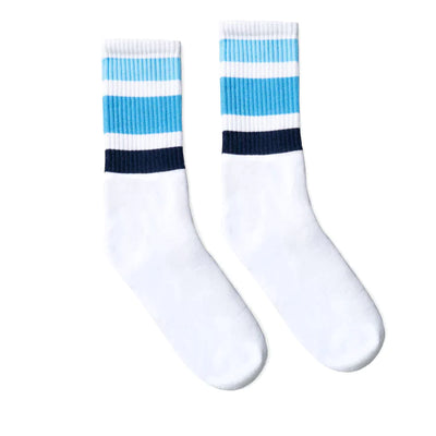 Socco white tube socks with 3 stripes in blue shades above the ankle.
