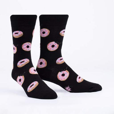 Black socks with pink glazed donuts.