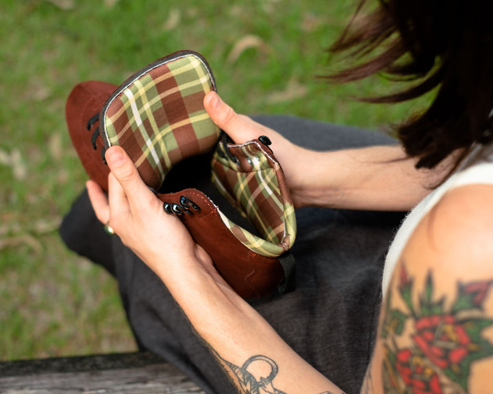 Chuffed Jade Hannah Pro Boots, deep chocolate suede roller skate boots with a brown and green tartan lining.