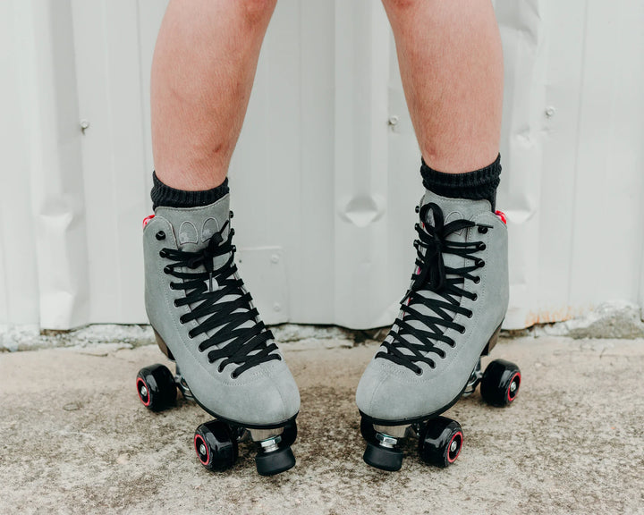 Chuffed Skates Wanderer Plus in Concrete grey with pink and red swirl lining, black wheels and toe stop.