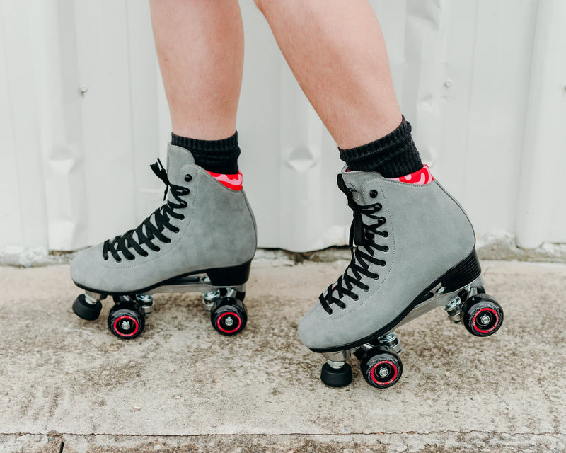 Chuffed Skates Wanderer Plus in Concrete grey with pink and red swirl lining, black wheels and toe stop.