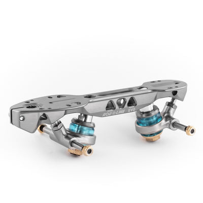 Roll-Line Evo plate with a graphite colour finish, gold hardware accents and blue elastomer cushions.