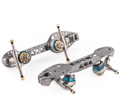 Roll-Line Evo plates with a graphite colour finish, gold hardware accents and blue elastomer cushions.