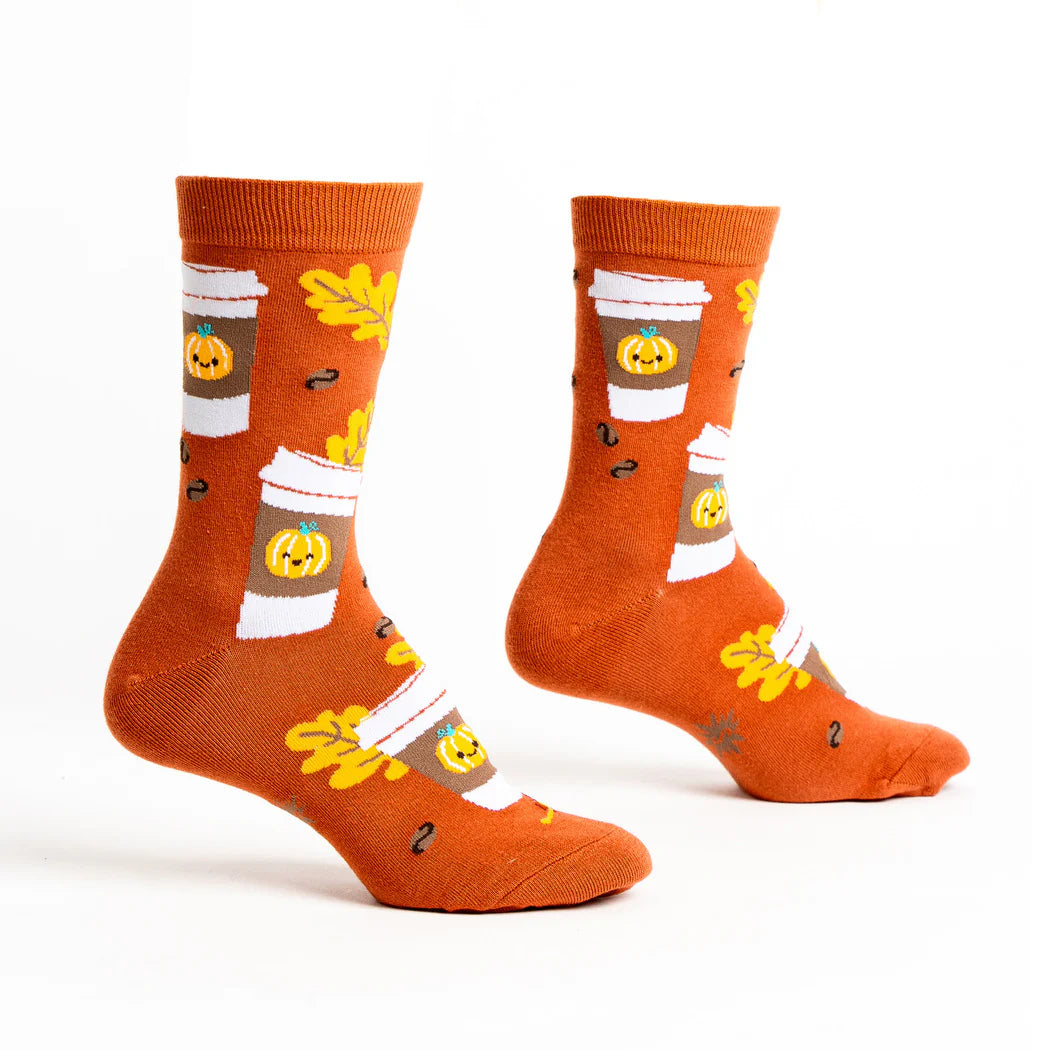 sock it to me socks in burnt orange with cartoon pumpkin spice latte cups and autumnal leaves