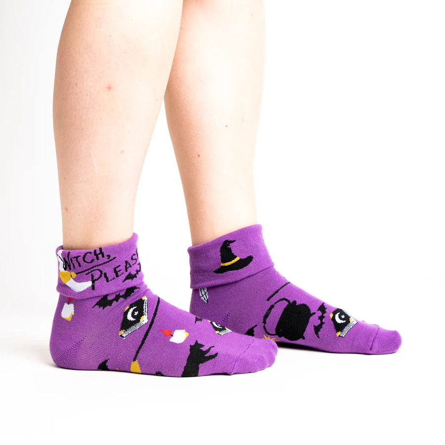 sock it to me turn cuff crew socks in grape purple with witches hats, cauldrons, cats, broomstick and spellbooks.