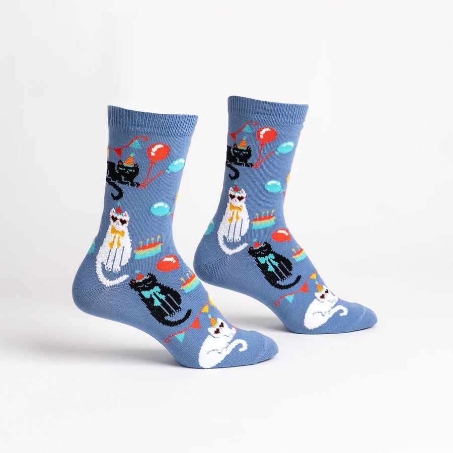 Steel blue socks with black and white cats having a birthday party, with hats, balloons and cake