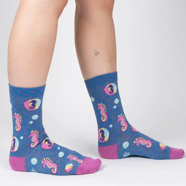 Blue, purple and yellow marle sock with seahorses and bubbles.