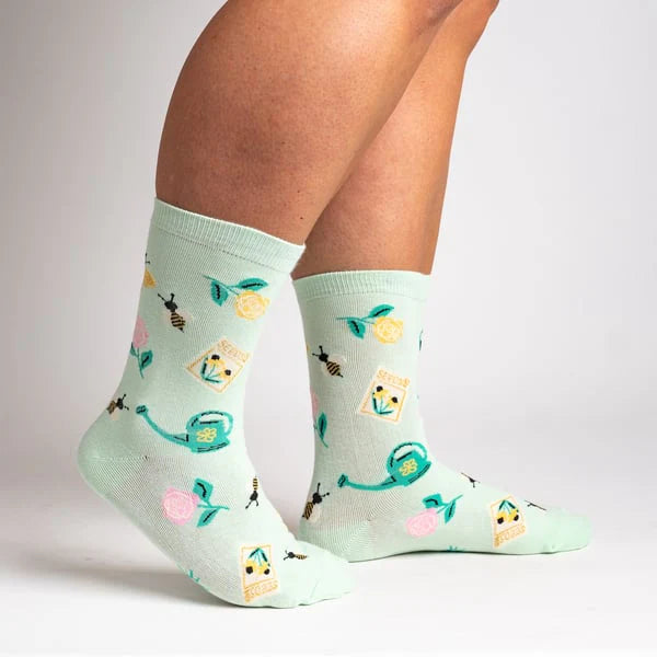 Sock it to Me Womens crew socks - Sow in Love - pastel mint with yellow flowers, bees, watering can, seed packets and pink flowers.