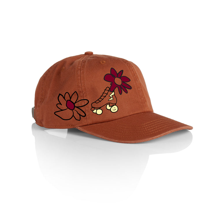 RollerFit Janky Skate Cap, rust orange with black/cream/maroon embroidered flowers and roller skate.