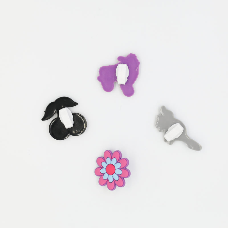 Four lace charms with roller skate, flower, cherry and skating platypus designs.