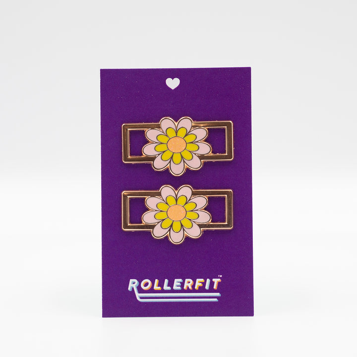 The popular RollerFit lace locks accessory featuring a pink and yellow  retro flower.