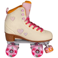 Pink and cream Chaya Cozy Summer Breeze roller skates with heart designs on a white background