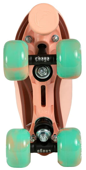 View of Dusty Pink Chaya Melrose Elite roller skate plate with mint green wheels on a white background
