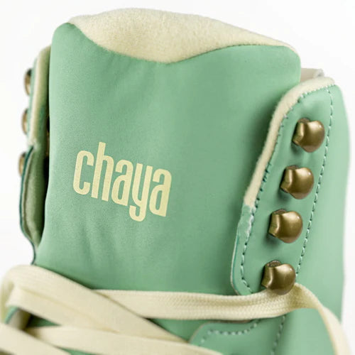 Close up of Mint green Chaya Melrose Elite roller skate with mint green wheels and dusty pink plate and toe stop on a white background
