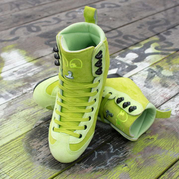 Pair of bright green Rib Pro Boots from Chuffed Skates on a wooden surface