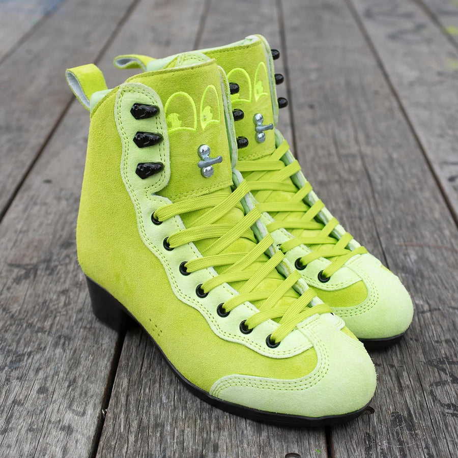 Pair of bright green Rib Pro Boots from Chuffed Skates on a wooden surface