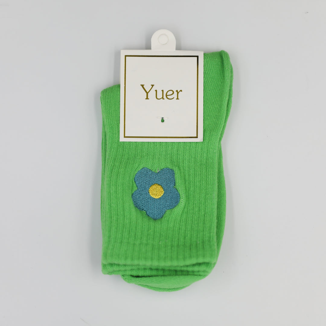 Lime green ribbed crew socks with turquoise embroidered flower on the side above the ankle