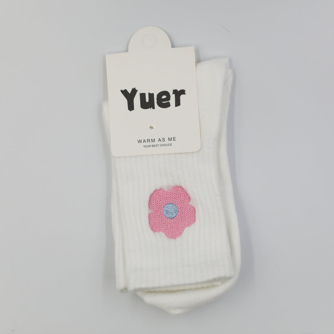 White ribbed crew socks with pink embroidered flower on the side above the ankle