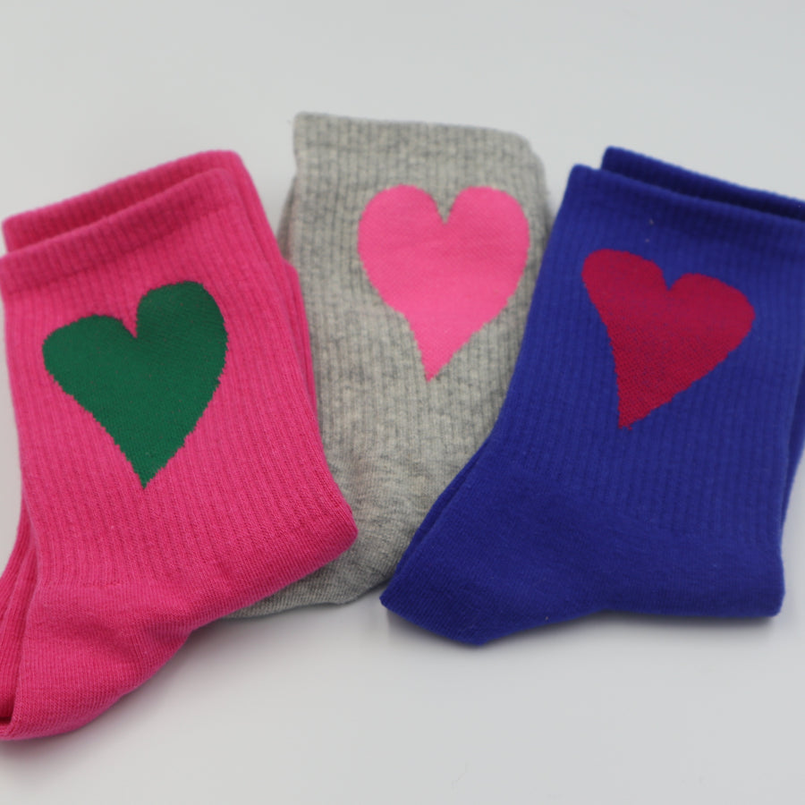 RollerFit ribbed crew socks with a single large heart design left to right: hot pink with bottle green heart, grey marle with baby pink heart, ultramarine blue with crimson heart.