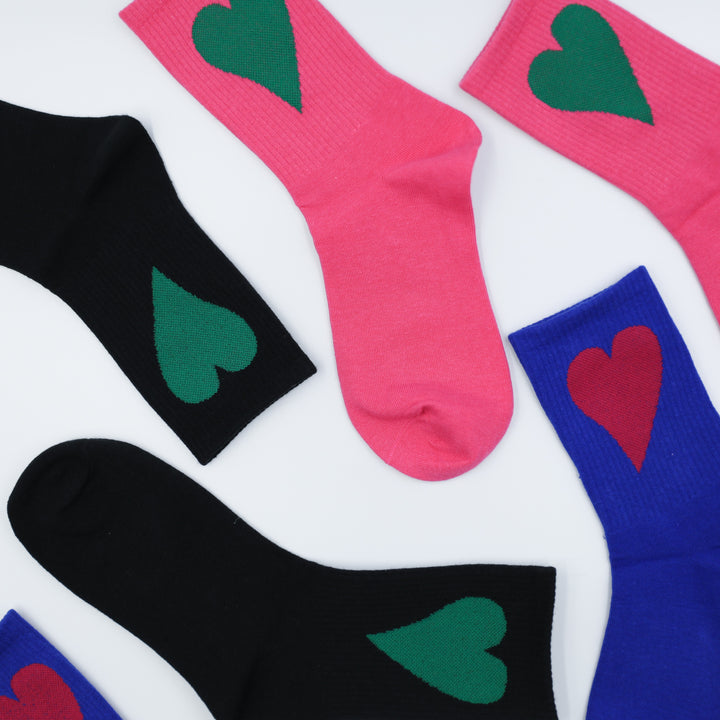Colorful socks with heart designs on a white background