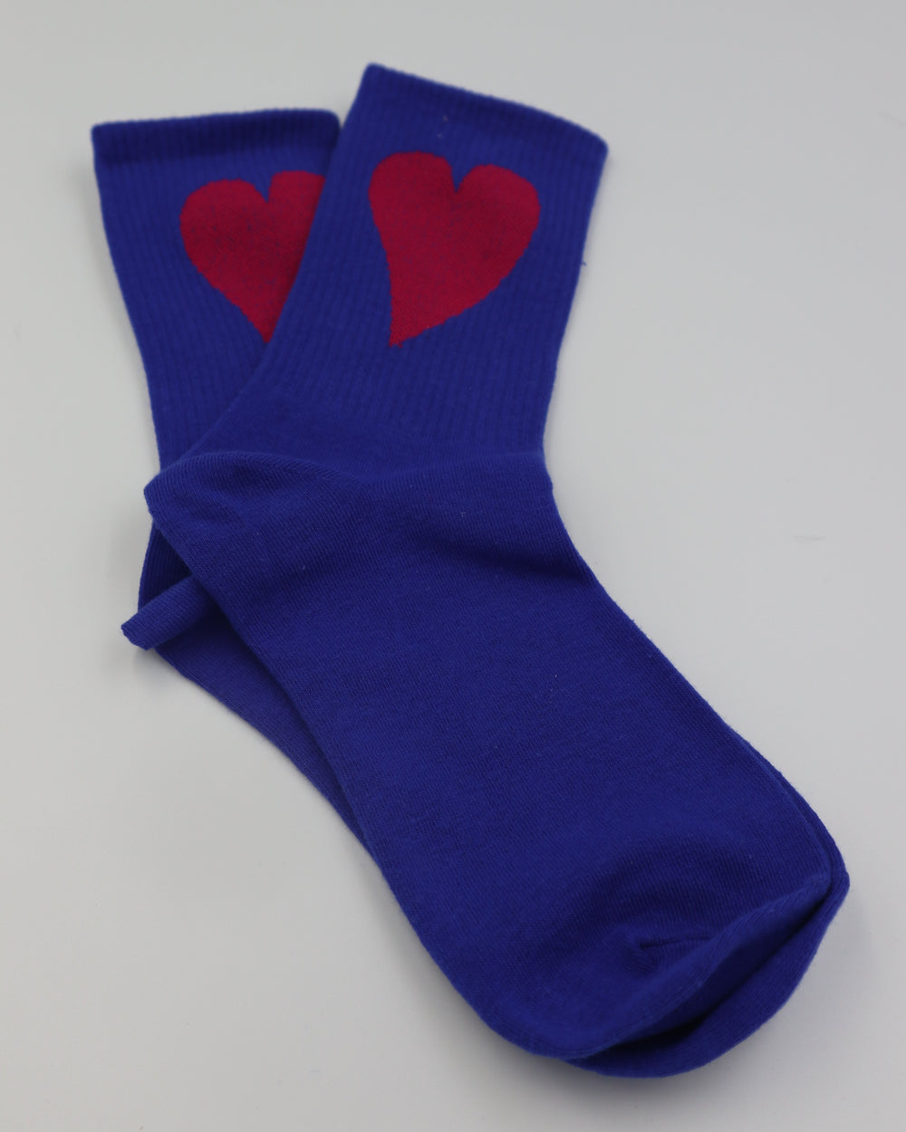 RollerFit ribbed crew socks with a single large heart design: ultramarine blue with crimson heart.