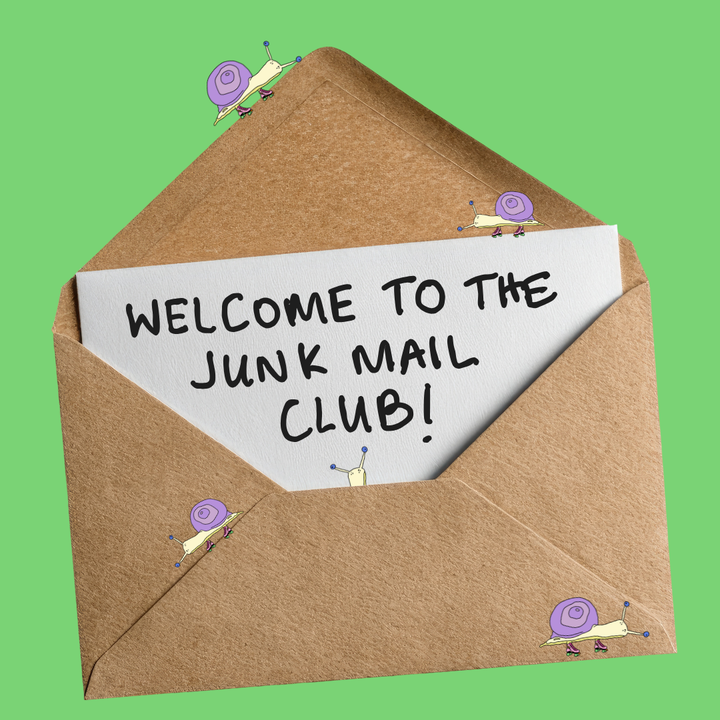 Open brown envelope with a white slip inside reading 'Welcome to the Junk Mail Club!' on a green background.