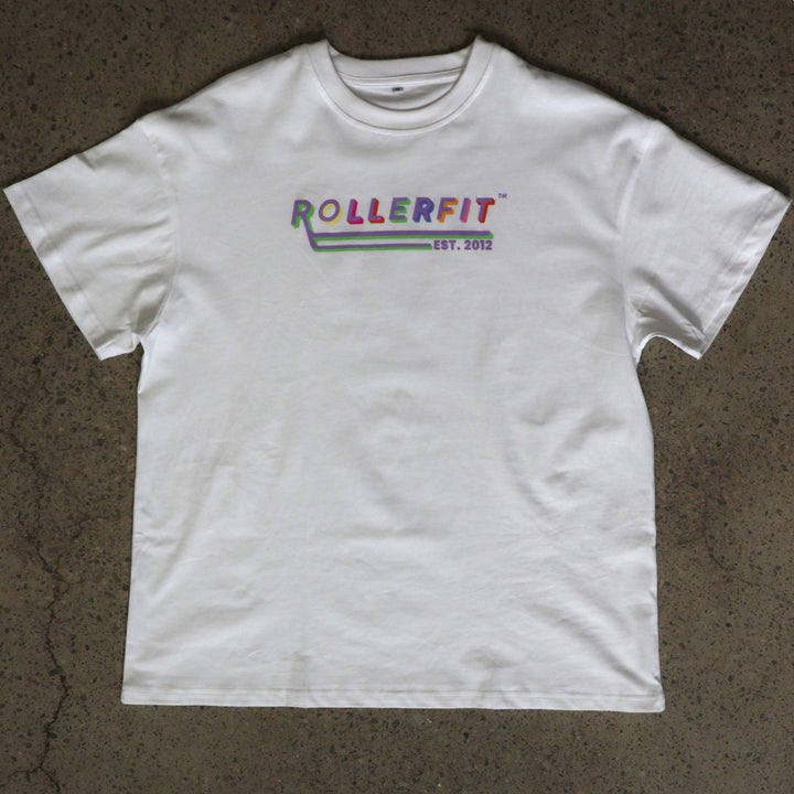 White t-shirt with 'ROLLERFIT' logo on a textured brown surface